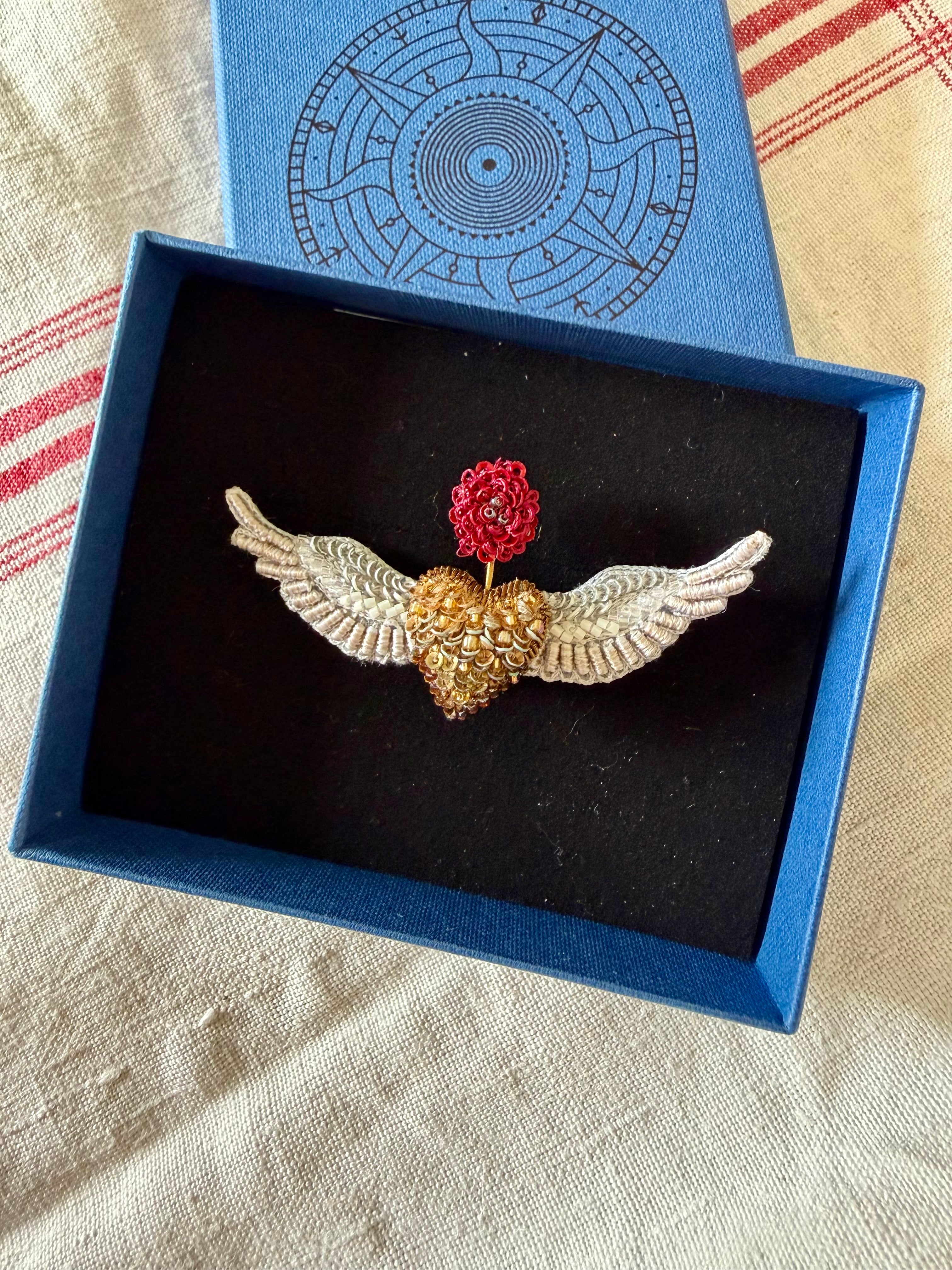 Flying angels brooch